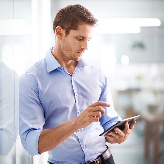woman looking into a tablet