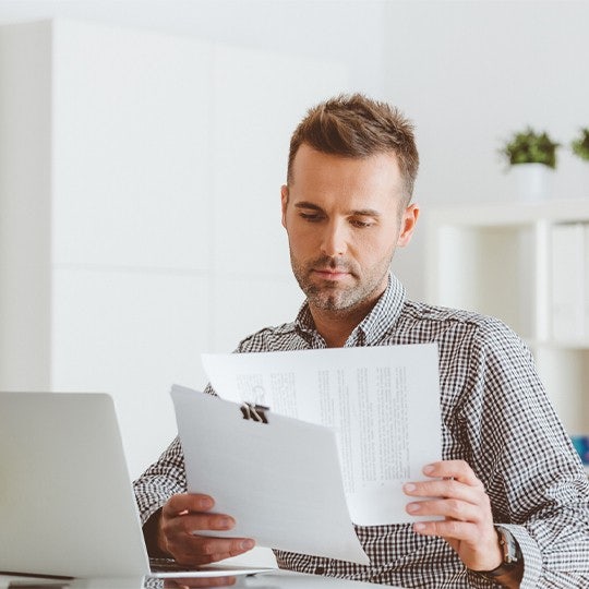 man with documents