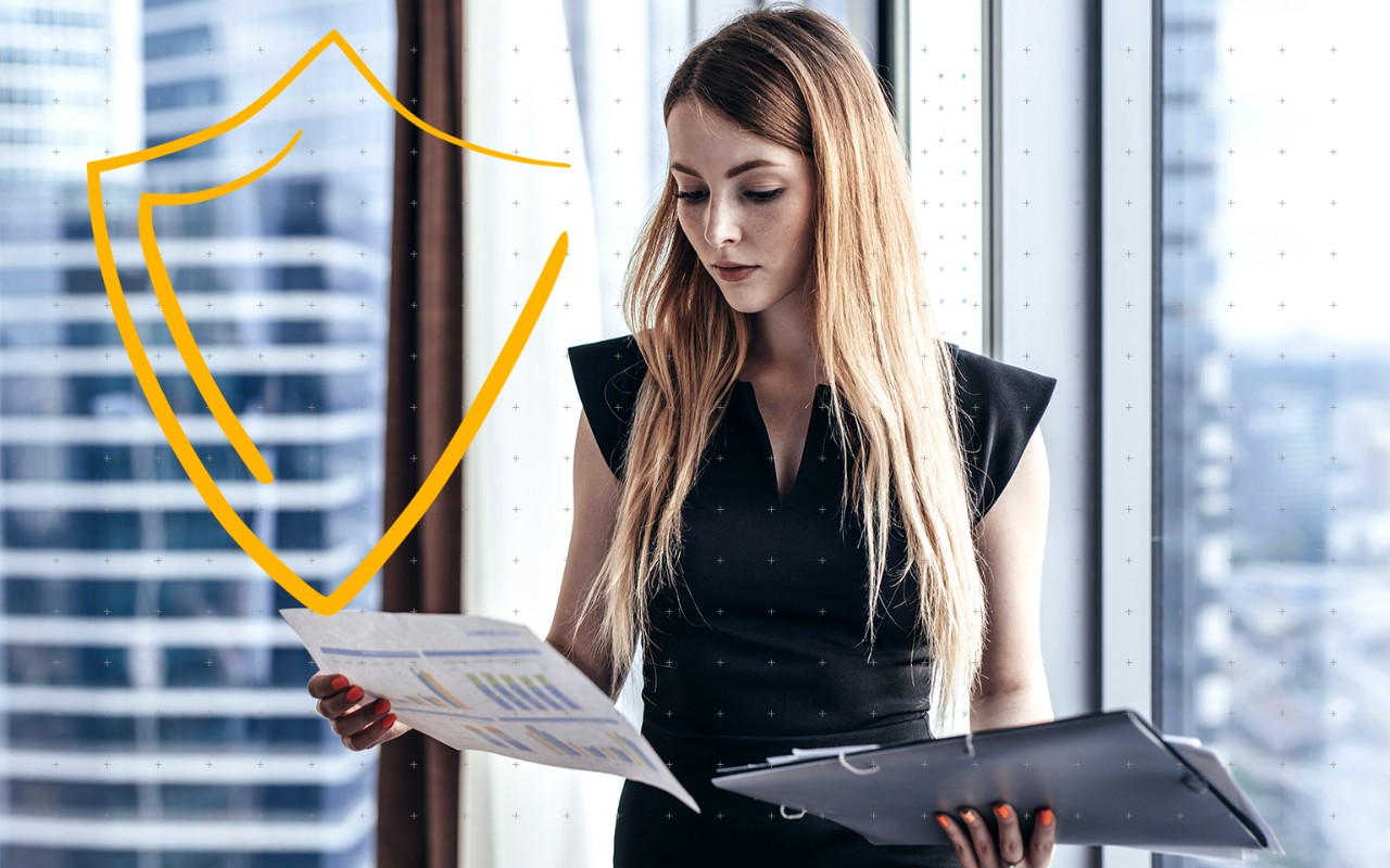 Close up of hand plugging a USB stick into a laptop