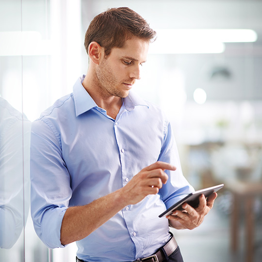 woman looking into a tablet