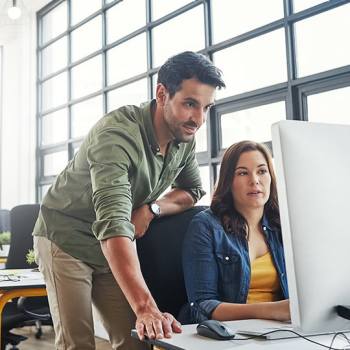Kyocera Gruppe colleagues working in an open plan office