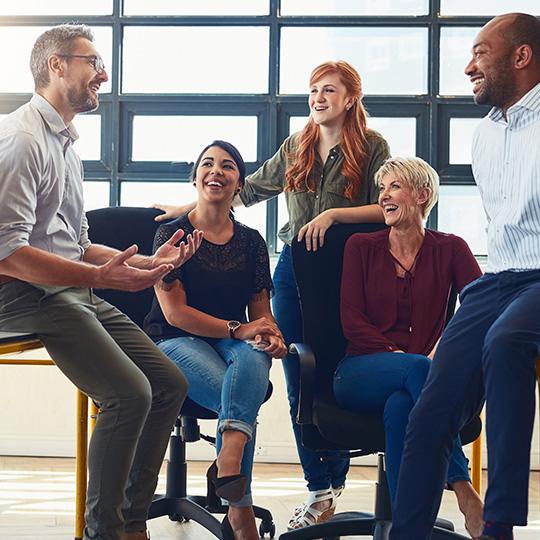 «Respect the Divine and Love People» group of colleagues in a meeting